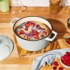 4 Quart Enameled Cast Iron Round Dutch Oven with Petal Design Lid, White Icing by Drew